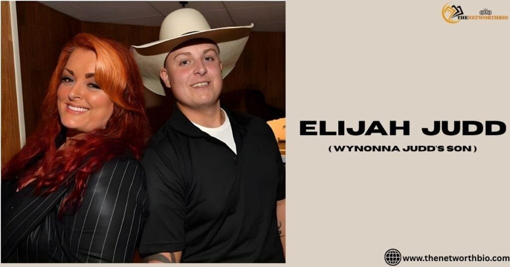 Elijah Judd posing alongside his mother Wynonna Judd at a public event.